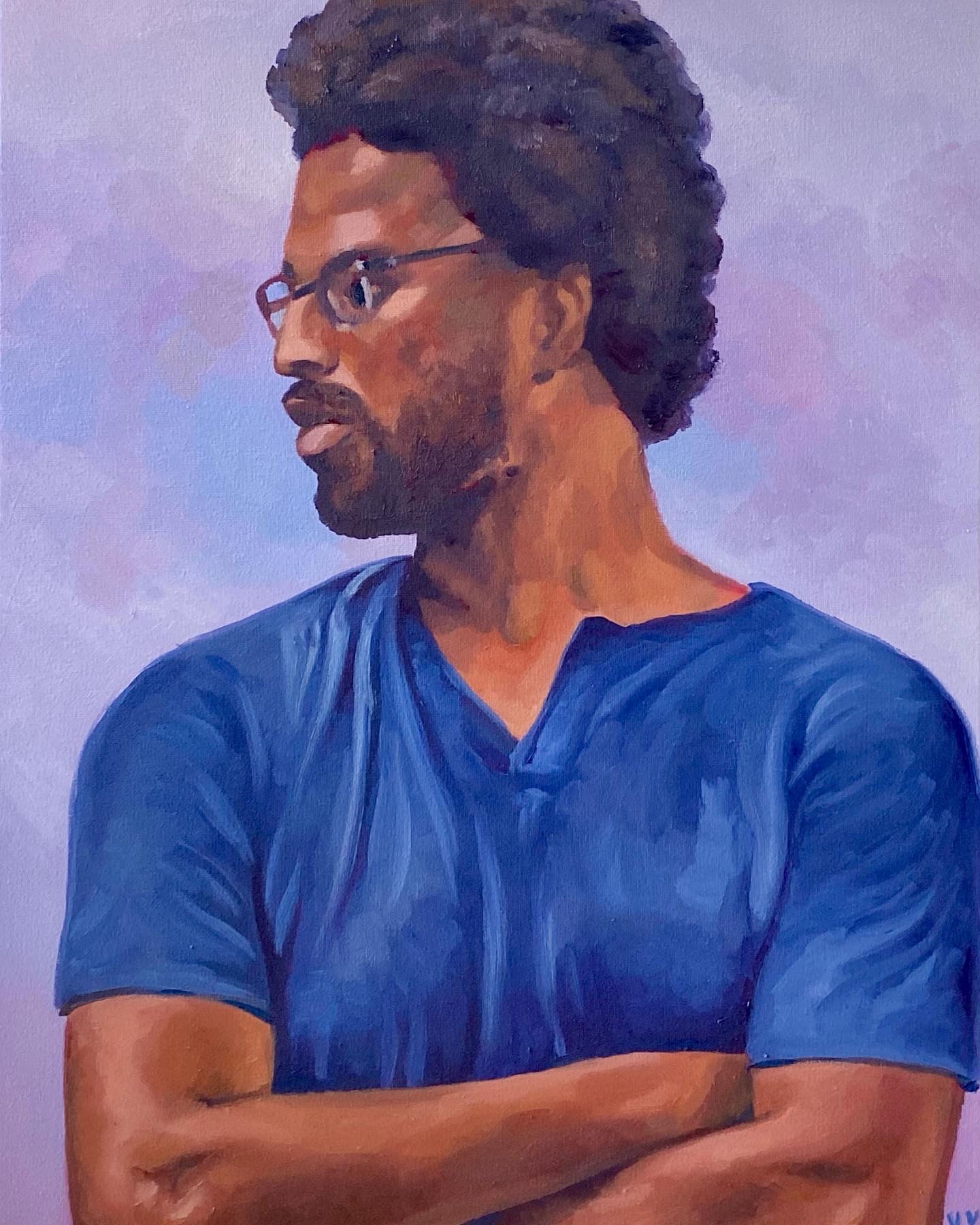 a portrait of a guy with crossed arms