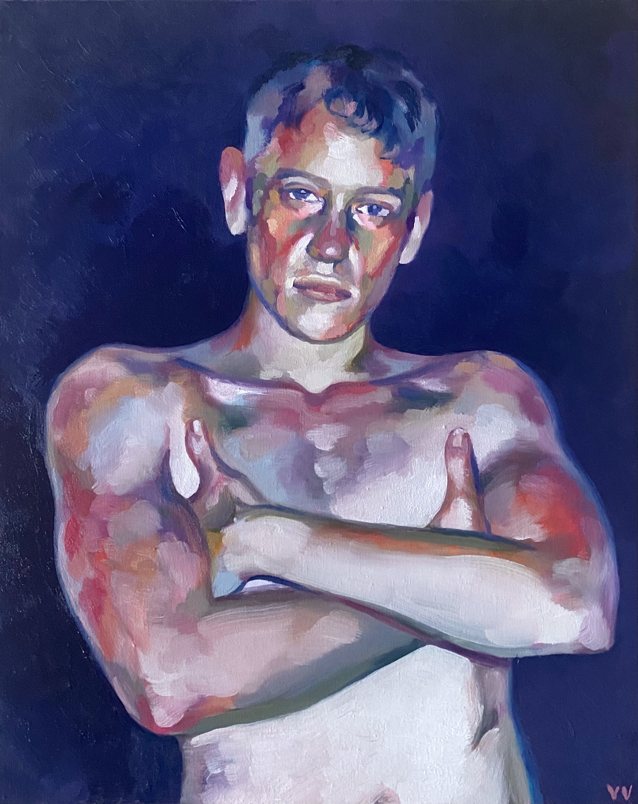 a portrait of a guy with crossed arms