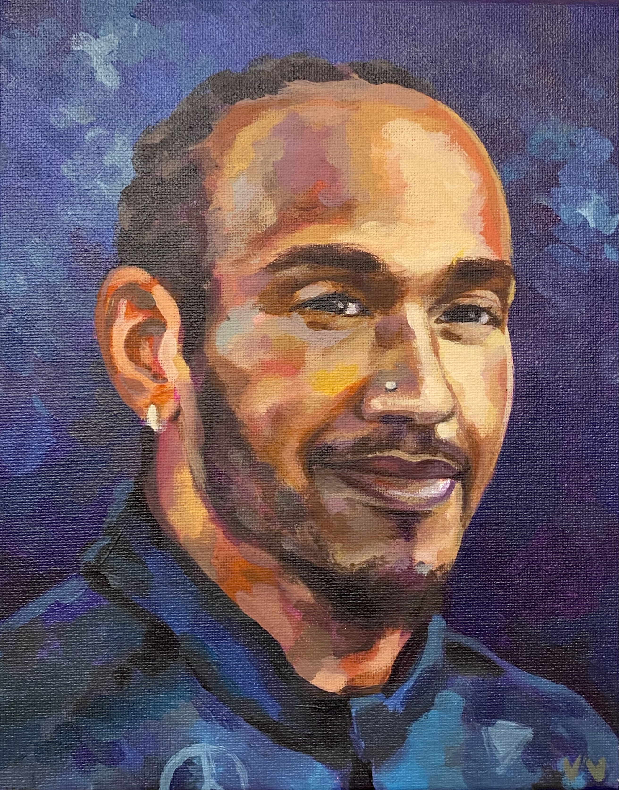 a portrait of a guy with crossed arms